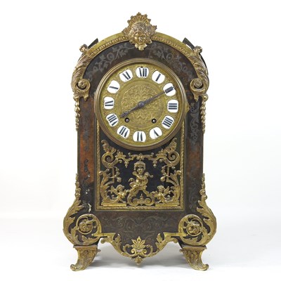 Lot 128 - A 19th century French cut brass and tortoiseshell mantel clock