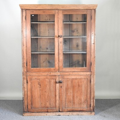 Lot 595 - An antique pine cabinet