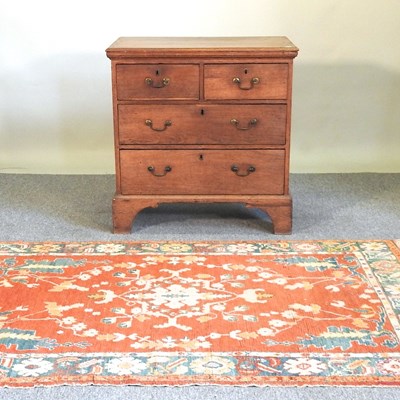 Lot 661 - A chest and rug