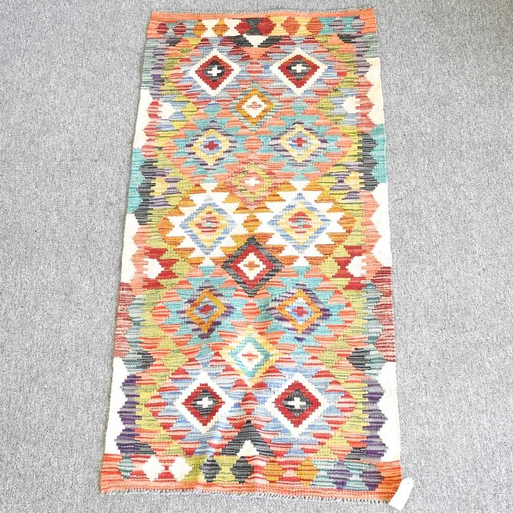 Lot 287 - A kilim runner