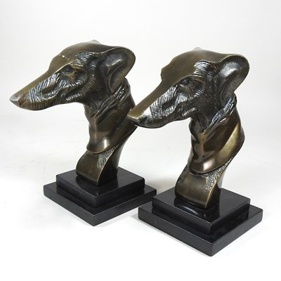 Lot 582 - A pair of bronzed heads