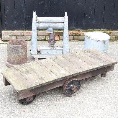 Lot 523 - A trolley and cans