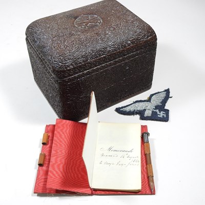 Lot 210 - A cigarette box and notebook