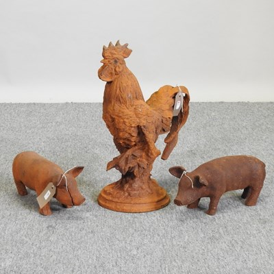 Lot 448 - A pair of small rusted metal models of piglets