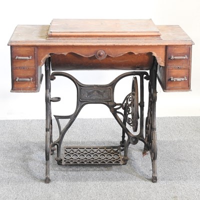 Lot 126 - A Singer sewing table