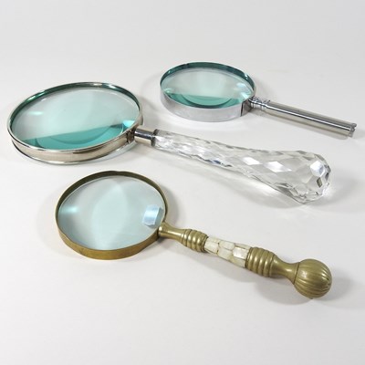 Lot 552 - Three magnifying glasses