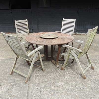 Lot 636 - A garden table and chairs