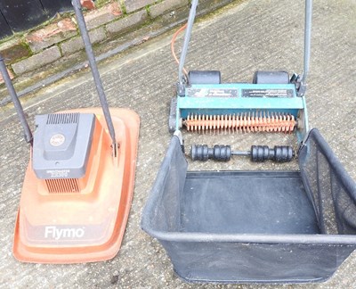 Lot 567 - A Flymo and scarifier