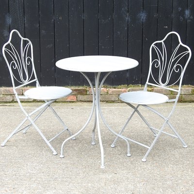 Lot 510 - A table and chairs