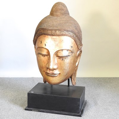 Lot 489 - A large Buddha head