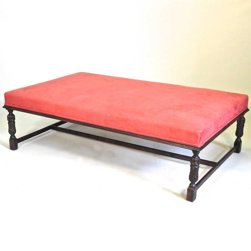 Lot 203 - A large red upholstered coffee table