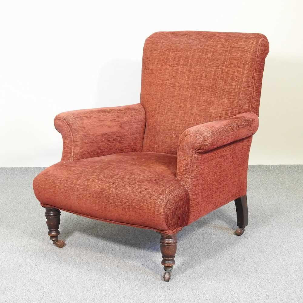 Lot 463 - A red upholstered armchair