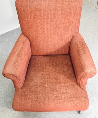 Lot 463 - A red upholstered armchair