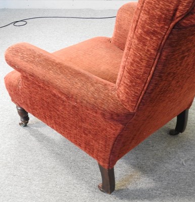 Lot 463 - A red upholstered armchair