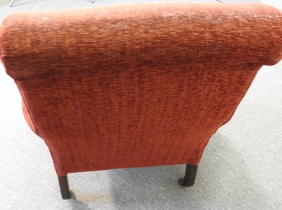 Lot 463 - A red upholstered armchair