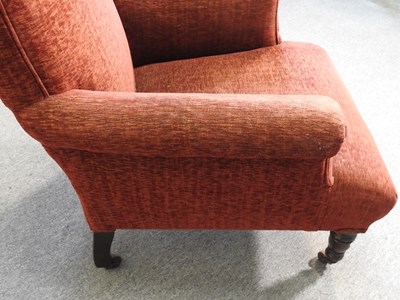 Lot 463 - A red upholstered armchair