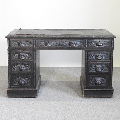 Lot 575 - A carved green man desk