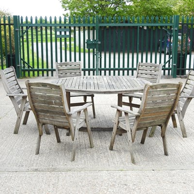 Lot 8 - A teak garden table and chairs