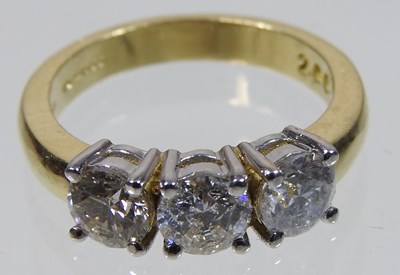 Lot 45 - An 18 carat three stone diamond ring