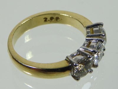 Lot 45 - An 18 carat three stone diamond ring