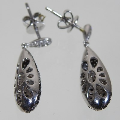 Lot 34 - A pair of 18 carat gold diamond pendant earrings