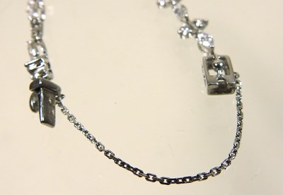 Lot 61 - An 18 carat white gold and diamond line bracelet