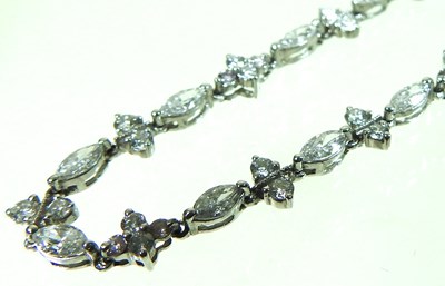 Lot 61 - An 18 carat white gold and diamond line bracelet
