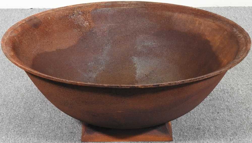 Lot 137 A rusted metal fire pit