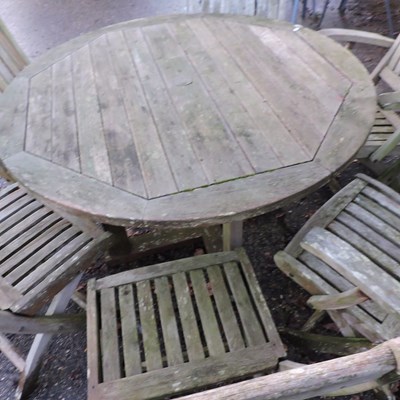 Lot 23 - A teak garden table