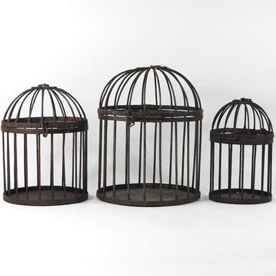 Lot 104 - A set of three bird cages