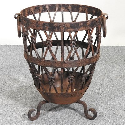 Lot 92 - A wrought iron log basket