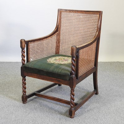 Lot 635 - A 1920's oak single cane bergere chair