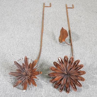 Lot 486 - Two large rusted flower heads