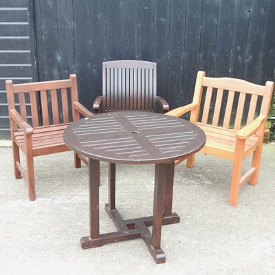 Lot 320 - A hardwood circular garden table