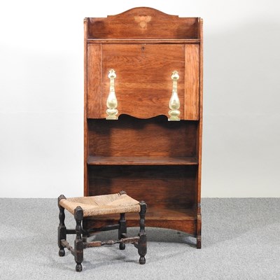 Lot 542 - An Arts and Crafts bureau and stool