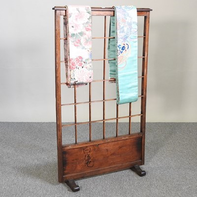 Lot 441 - A Japanese kimono stand and two obi