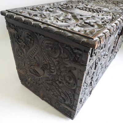 Lot 46 - An unusual 19th century continental heavily carved oak coffer
