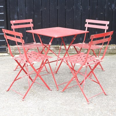 Lot 366 - A red painted metal garden table and chairs