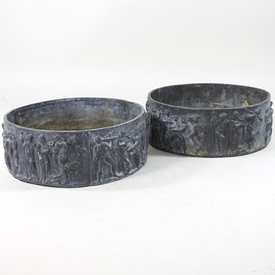 Lot 81 - A pair of small lead planters, with relief decoration