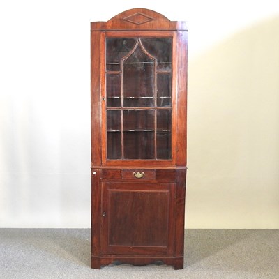 Lot 306 - A 19th century mahogany standing corner cabinet