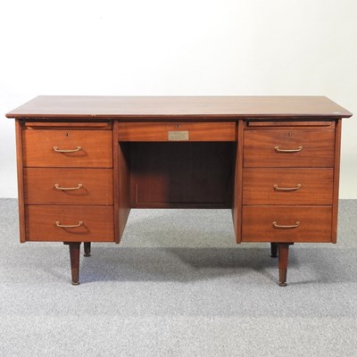 Lot 35 - A 1960's teak desk, with plaque for New Scotland Yard