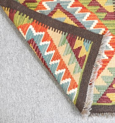 Lot 54 - A kilim runner