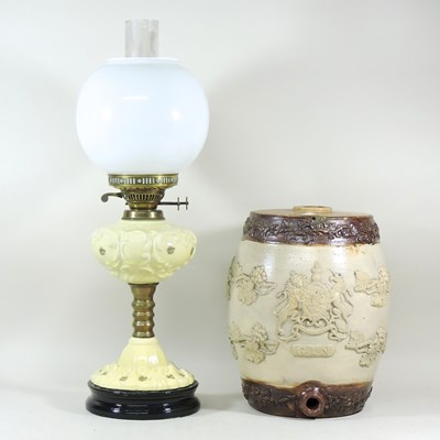 Lot 310 - A stoneware gin barrel and oil lamp