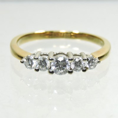 Lot 5 - An 18 carat gold five stone diamond ring