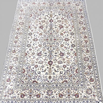 Lot 428 - A large Persian carpet