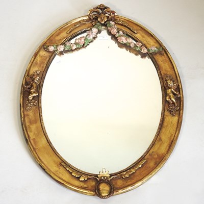 Lot 470 - A continental gilt framed oval mirror