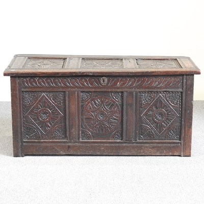 Lot 268 - An 18th century carved oak coffer