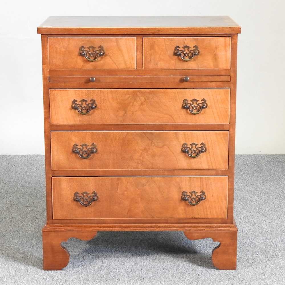 Lot 570 - A reproduction chest of drawers