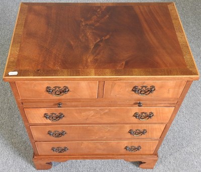 Lot 570 - A reproduction chest of drawers