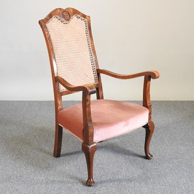 Lot 208 - An early 20th century cane back armchair